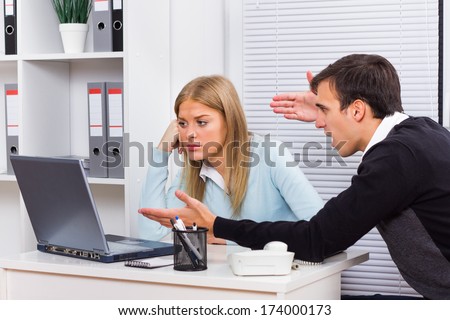 Businessman is sitting in office with his secretary and he is very angry at her because of something, Harassment at work
