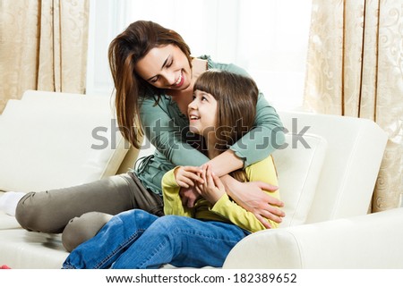 Portrait of mother and daughter spending time together at their home,Family time