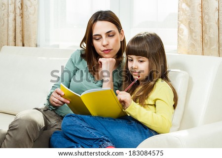 Angry mother has to do homework with her daughter because she will not do it by herself,she would rather play,I would rather play!