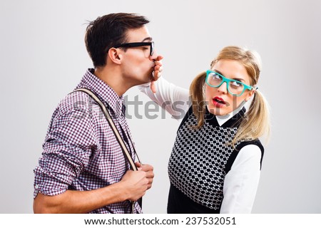 Nerdy man is trying to kiss his nerdy lady ,but she is pushing him away,Get away from me!