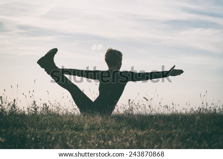 Woman practicing yoga,intentionally toned image.Yoga