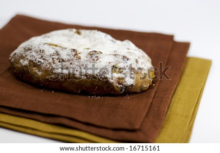 baked cake with sugar powder on a linen napkin