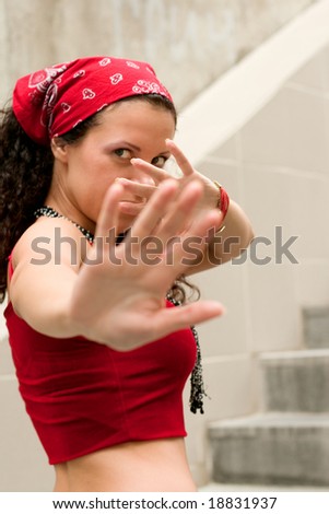 woman in red hides her face by hands