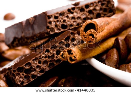 arrangement of chocolate, coffee and cinnamon sticks