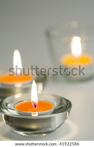 three candles flaming closeup