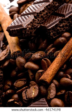 arrangement of chocolate, coffee and cinnamon sticks
