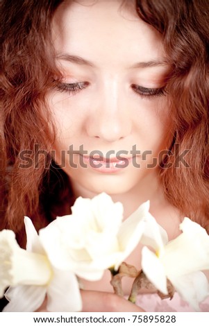 closeup portrait of beautiful woman with narcissus