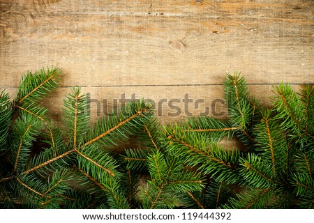 christmas fir tree on rustic wooden board