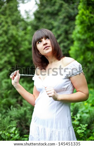 portrait of happy young woman in a forest