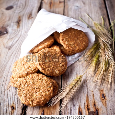 fresh crispy cereal cookies and ears on rustic wooden table
