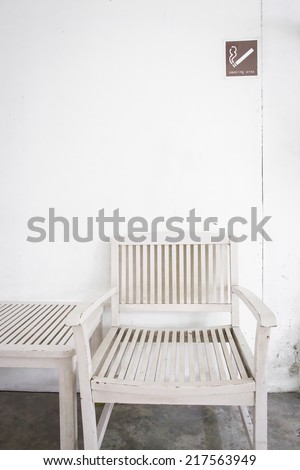 Smoking area with white chair