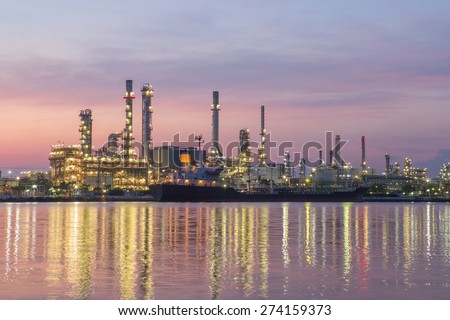 Refinery oil with river at twilight in morning
