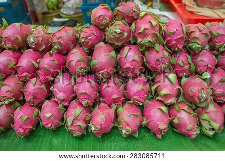 Dragon ball fruit on market stand, Thailand