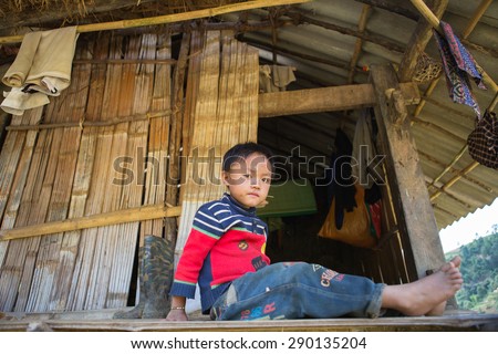MUCANGCHAI, VIETNAM - June 11: unidentified H\'mong ethnic minority kid relaxing in ethnic\'s house when his parents are working on the terraces on June 11, 2015 in Mu Cang Chai, Yen Bai, Vietnam