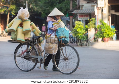 Hanoi , Vietnam - June 17; Life of Vietnamese June 17, 2015 . Goods vendor at street market in HANOI, VIETNAM