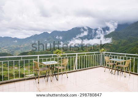 Tables and chairs for coffee time with scenic view of mountain in Sapa, Vietnam