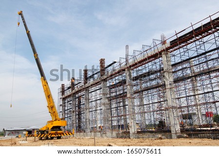 Construction site, workers on scaffolding