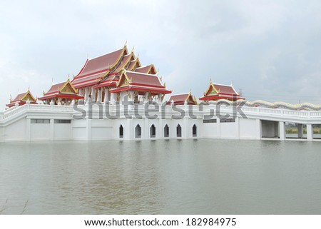 Traditional Thai style art of church on the water in temple, Thailand