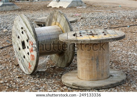 AYUTTHAYA-THAILAND-JANUARY 7 : Old wooden wheel of electrical wire in warehouse on January 7,2015 Bangkok, Thailand