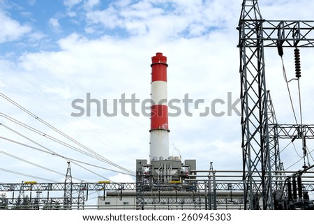 general view to high-voltage substation with switches and gas power plant, gas generator