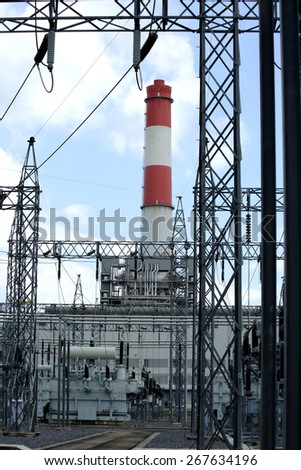 general view to high-voltage substation with switches and gas power plant, gas generator