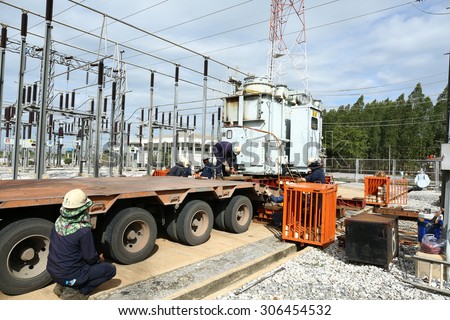RAYONG -THAILAND - AUGUST 5 :Workers are preparing the process of moving the old transformers large, up trailer. August 5, 2015 in Rayong province, Thailand