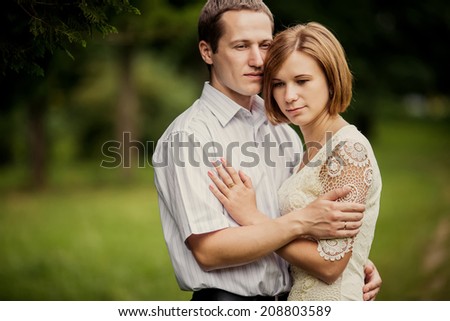 couple in love hugging at summer park