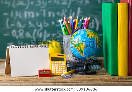 School supplies on the background of the school board