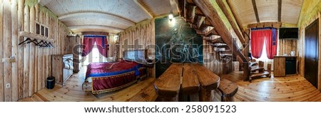 Unique ethnic interior. Traditional (national) design. The hotel room. Ukrainian style and specific decorations of Cossacks historical period. Europe, Ukraine, Carpathians, Hotel \