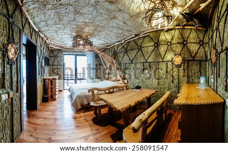 Unique ethnic interior. Traditional (national) design. The hotel room. Ukrainian style and specific decorations of Scythia historical period. Europe, Ukraine, Carpathians, Hotel 