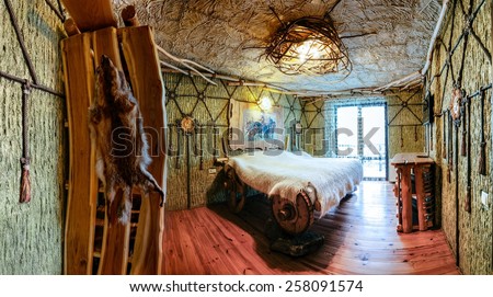 Unique ethnic interior. Traditional (national) design. The hotel room. Ukrainian style and specific decorations of Scythia historical period. Europe, Ukraine, Carpathians, Hotel \