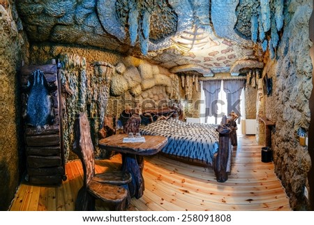 Unique ethnic interior. Traditional (national) design. The hotel room. Ukrainian style and specific decorations of Stone Age. Europe, Ukraine, Carpathians, Hotel \