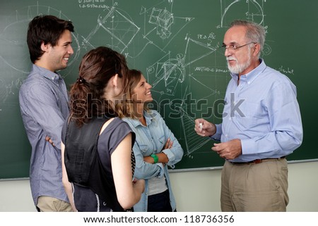 Teacher talking with students in the clasroom