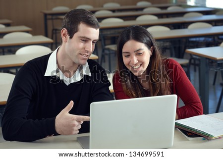 Two students with laptop