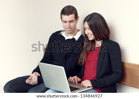 Two young people with laptop