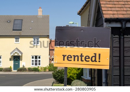 \'Rented\' sign outside a house closeup