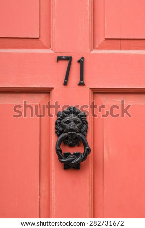 Number 71 seventy one painted door and lion head door knocker detail