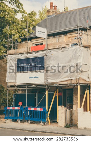 Scaffolding, construction boards and health and safety equipment of a building under construction