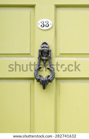 Door number 33 thirty three knocker with cobwebs closeup