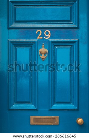 Door number 29 twenty nine knocker and letterbox concept closeup