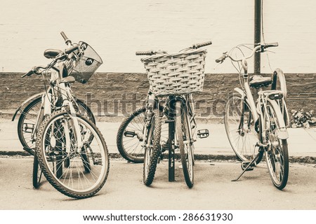 Bike rack with bikes in town centre conceptual monochrome image