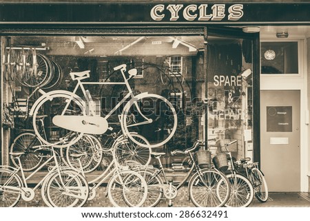 Cycles retailer and repair shop with bikes on display monochrome image