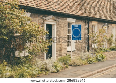 \'To Let\' sign outside Cottage for rent in English countryside