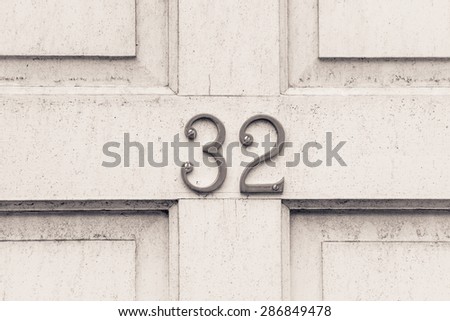 Door number 32 thirty two conceptual image closeup