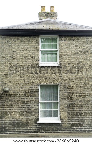 Sash windows and chimney vertical view of an English house closeup