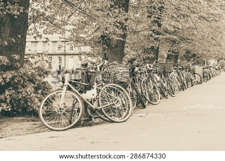 Conceptual image of student life in Cambdrige, bikes locked next to Parker\'s piece, England closeup