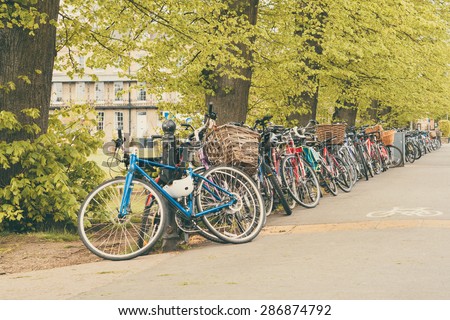 Conceptual image of student life in Cambdrige, bikes locked next to Parker\'s piece, England closeup