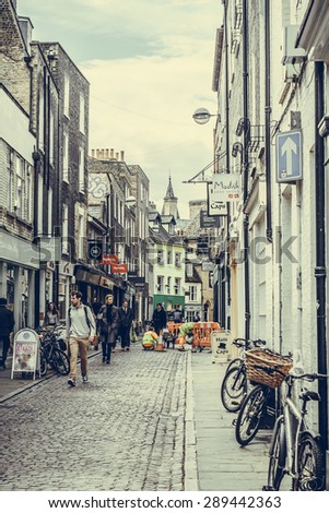 CAMBRIDGE, ENGLAND - 7 MAY 2015: Shoppers in Green street in beautiful city of Cambridge, England