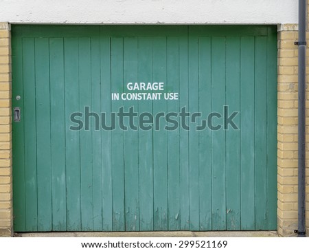 Closed garage door with sign \'Garage In Constant Use\'