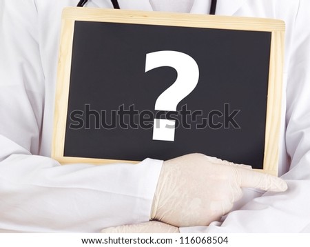 Doctor shows information on blackboard: question mark